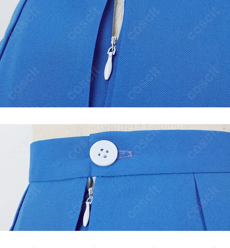 スカートのボタンとチェーン風装飾のディテール。細部の質感を強調