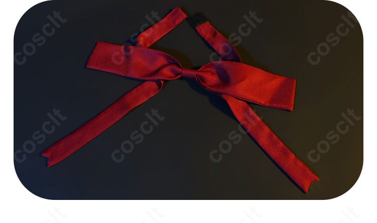 赤いリボンの近接画像。色の深みと結び目の形状が分かるディテールカット。