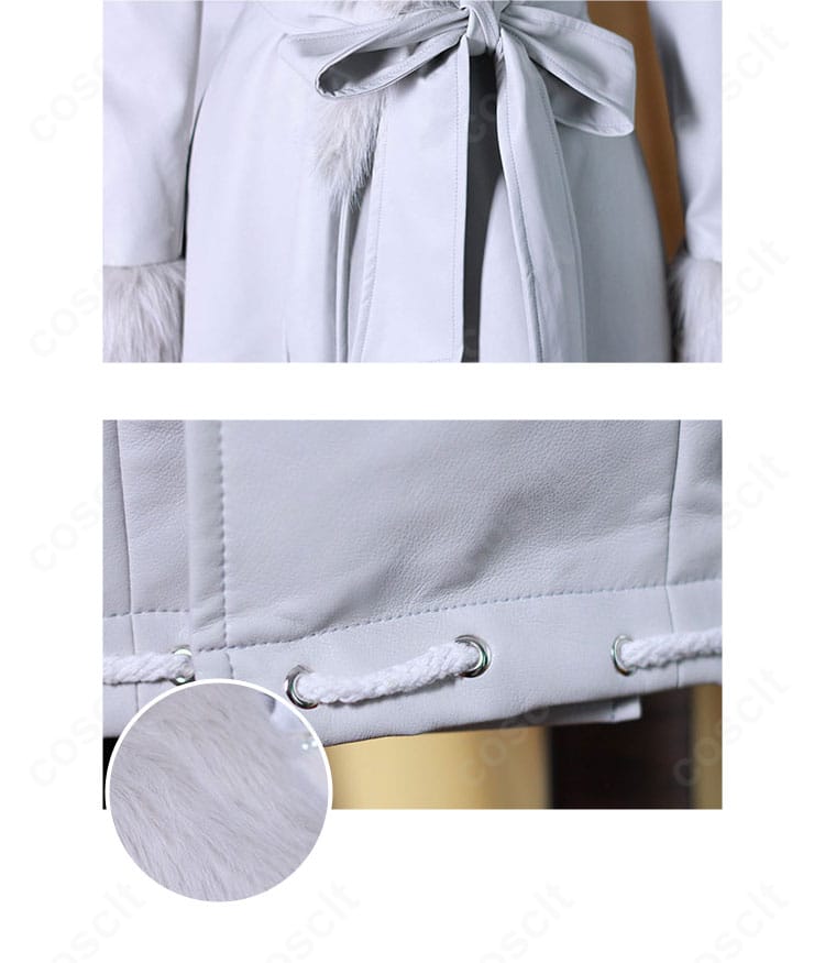 腰の細帯と裾飾りのディテール。ウエストマークと裾のデザインバランスを示す近接画像。