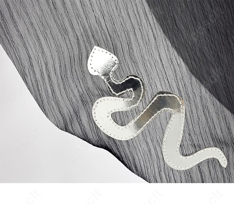 トレイシー・レズニック衣装 裾ディテール。ステッチワークとラインの美しさを示す近接写真。