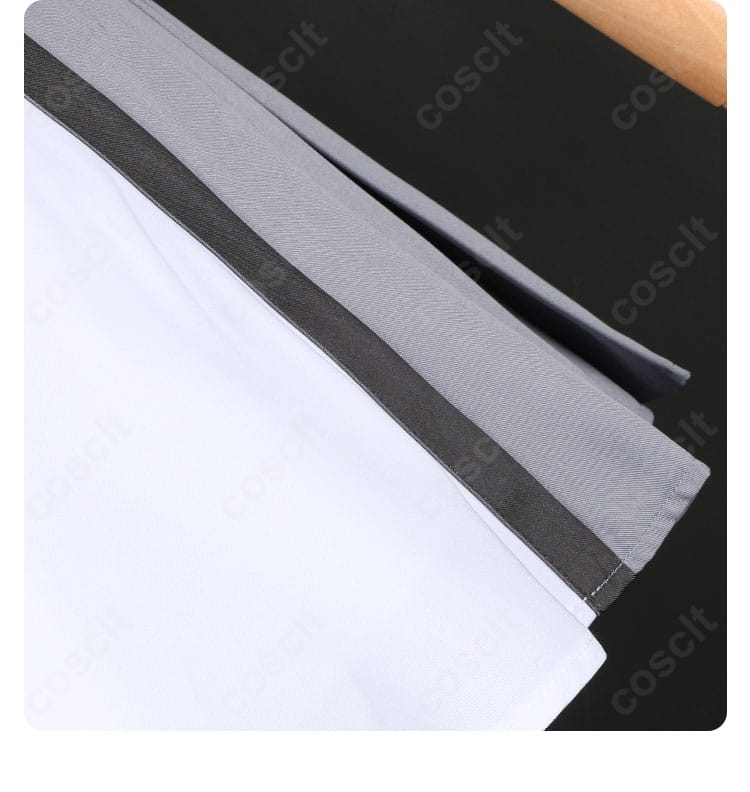 スカート裾の装飾ディテール。落ち着いた色味と縁取りが分かるヘムラインの拡大。