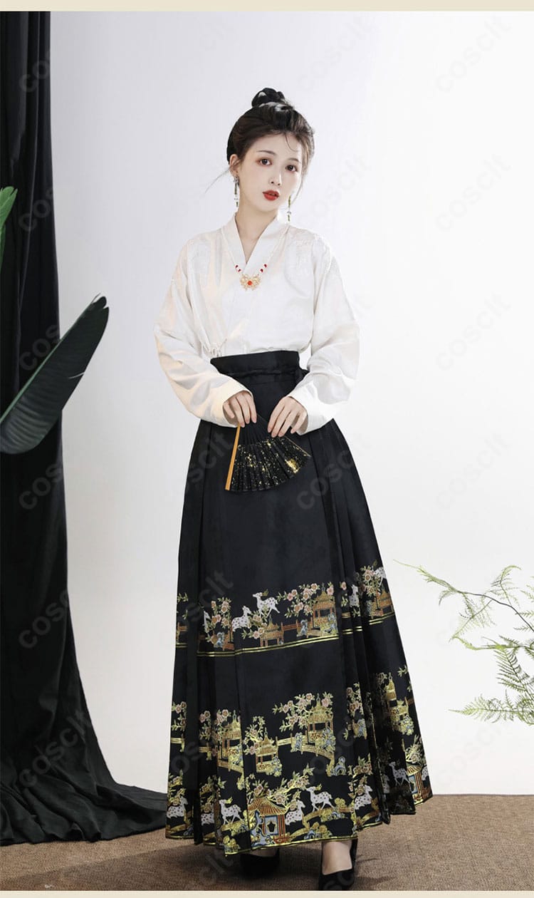 中華風トップスのフロントディテール。縁取りと素材感、縫製の丁寧さが際立つ。