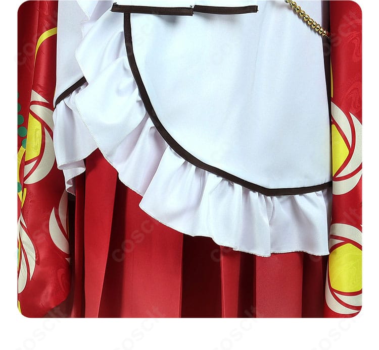 エプロン全体の装飾バランス。華やかな意匠がコーデ全体を引き締める。